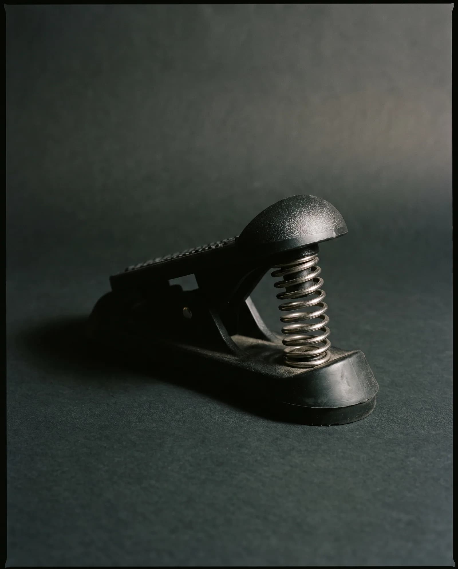 Foot Corrector — Cast aluminium arch trainer with a steel spring.