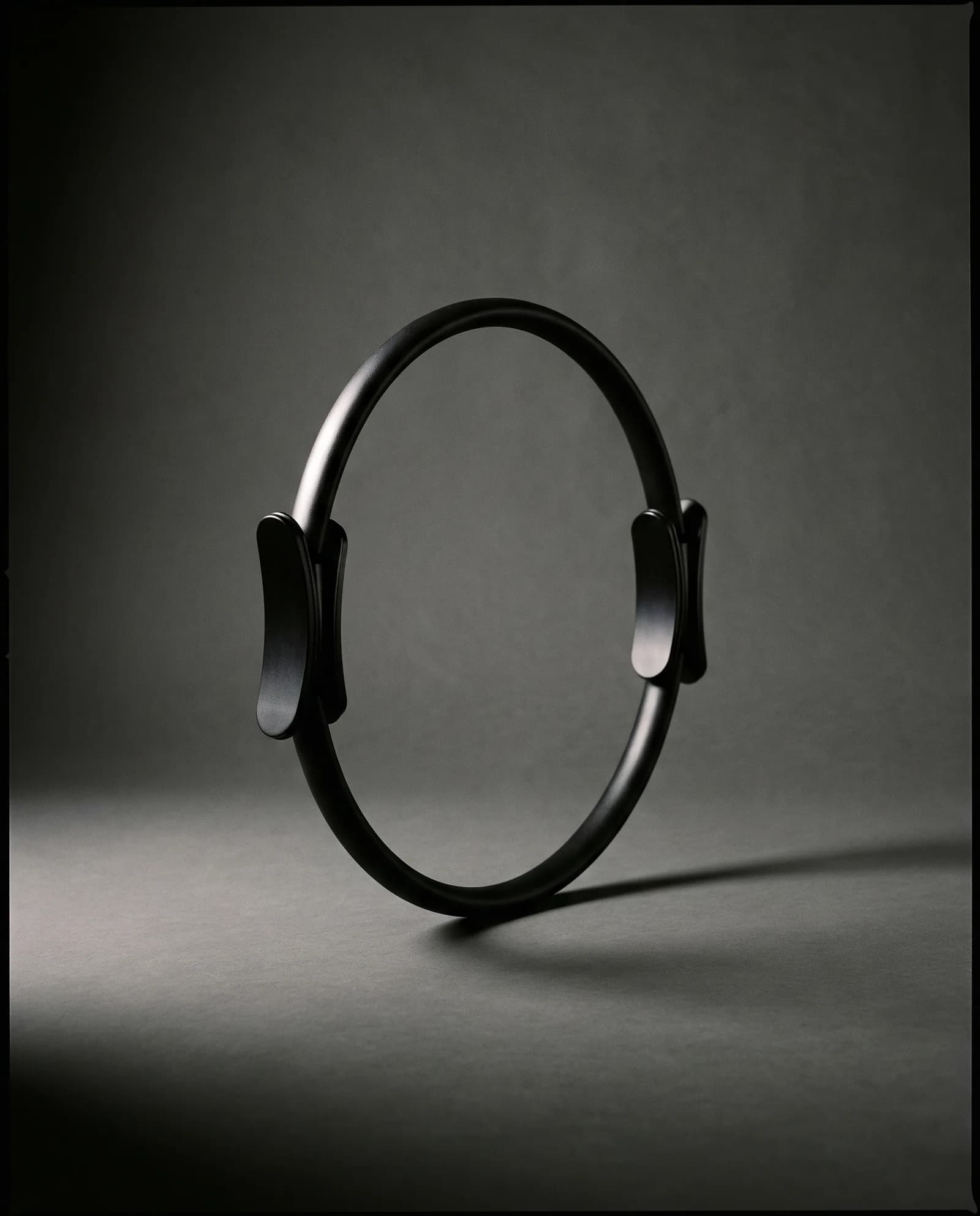 Magic Circle — Spring steel ring, machined aluminium pads.