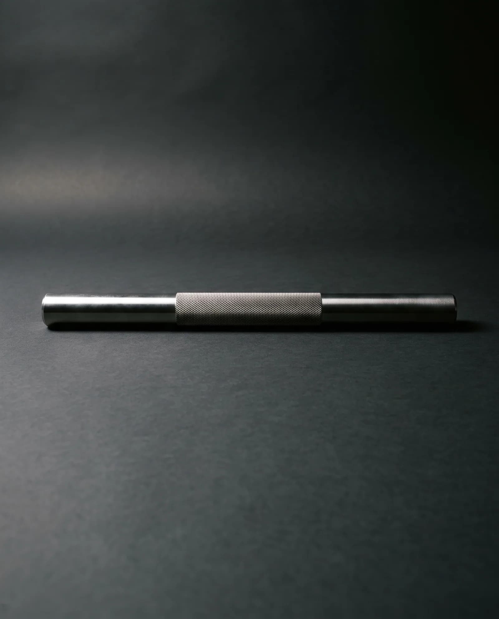 Sculpt Bar — 8 lb machined steel bar, knurled through the grip.