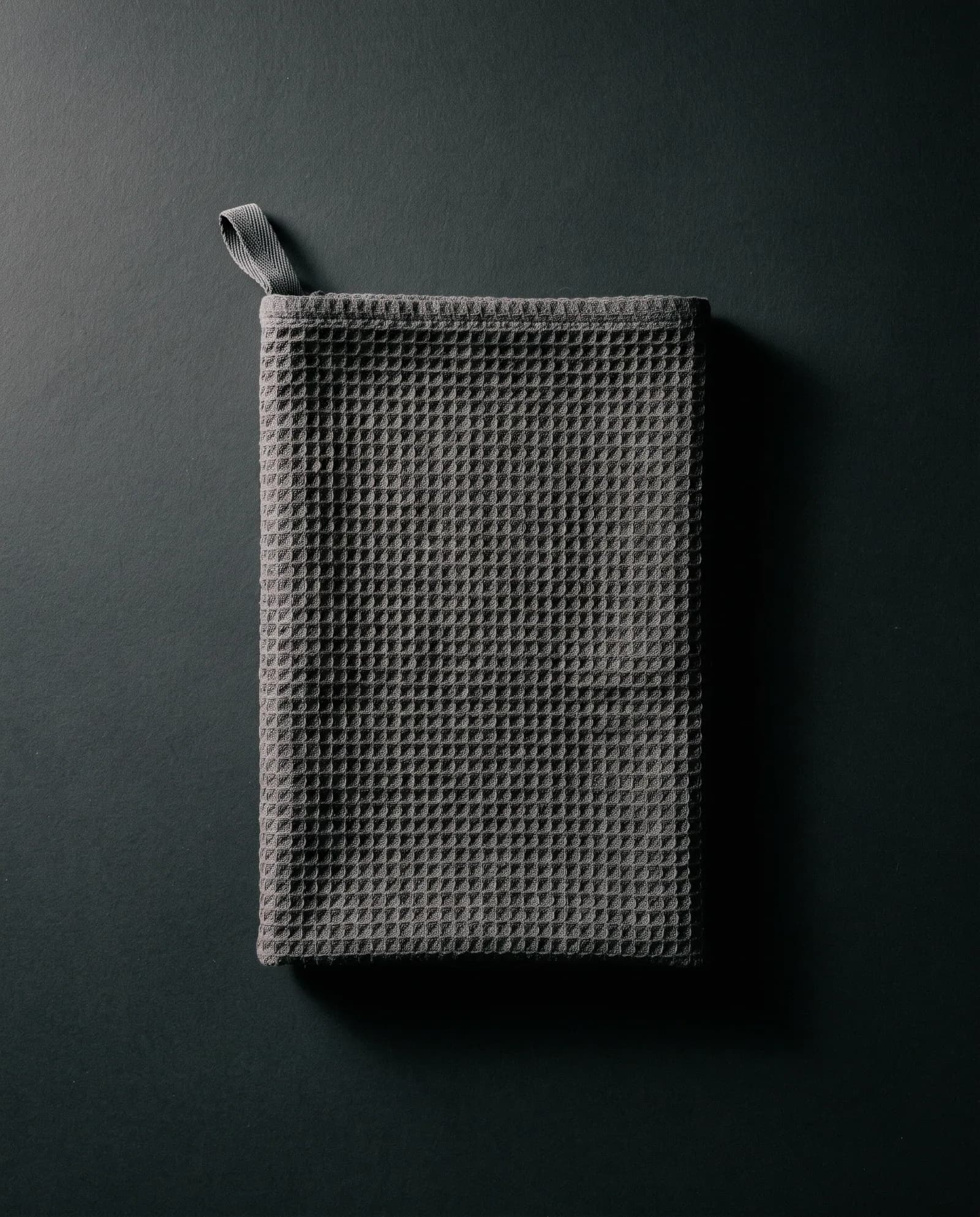 Sweat Towel — Waffle-weave cotton, hanging loop.